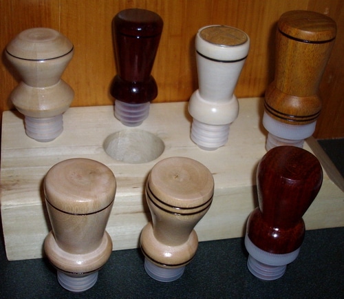 A variety of wine bottle toppers.