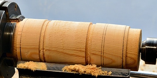 Woodturning placing the rings on the barrel