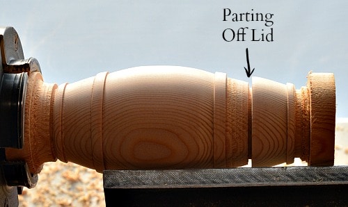 Woodturning parting off the top of the barrel