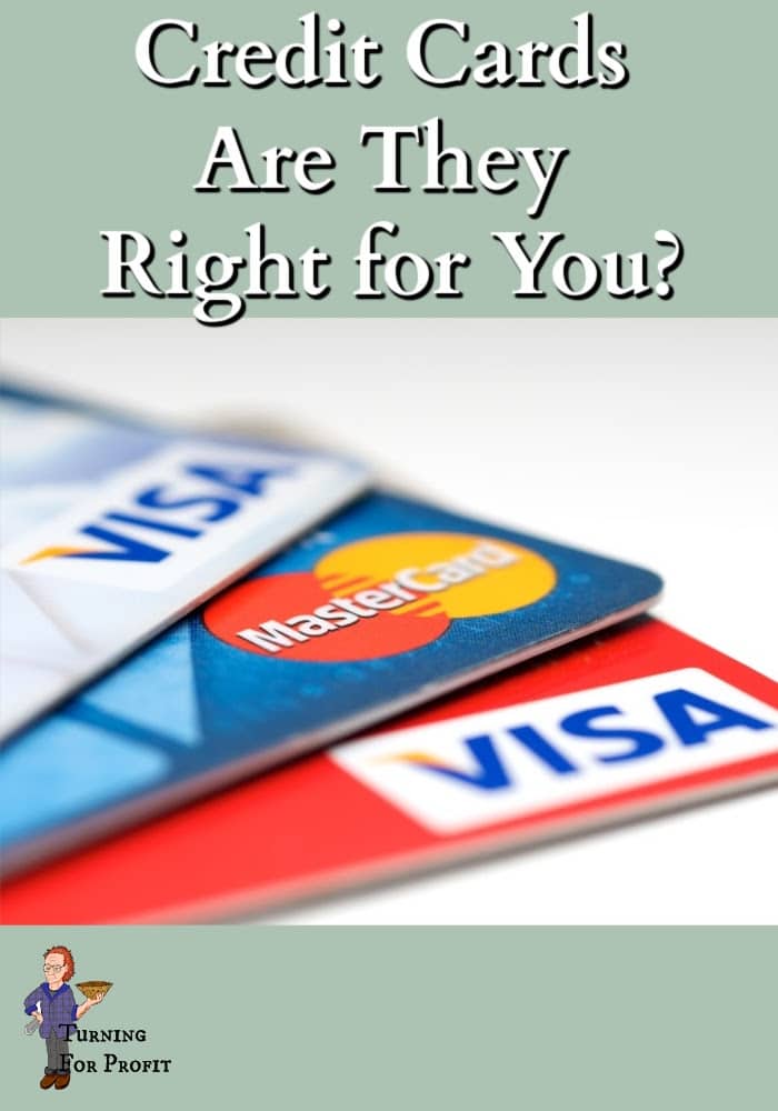 Visa and Mastercard credit cards fanned out on a white background