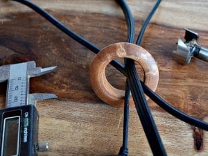 A wooden grommet for your home office computer chords