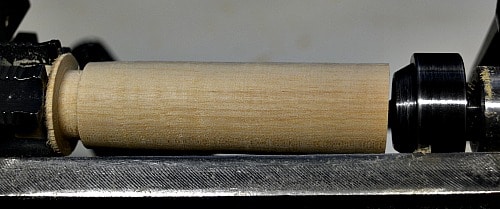 wooden handle with a section parted away near the head stock